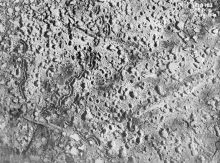 Aerial view, somewhere over the Ypres Salient, showing the pock-marked earth, riddled with shell craters, and the remains of several trenches.
